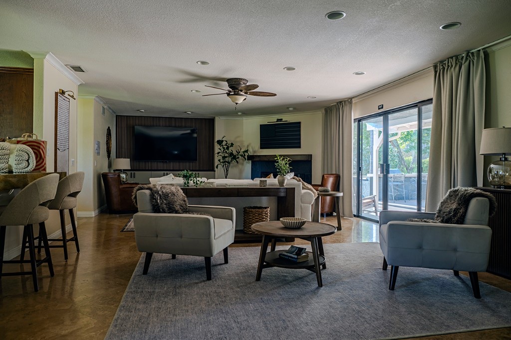 Spacious common lounge with seating and fireplace